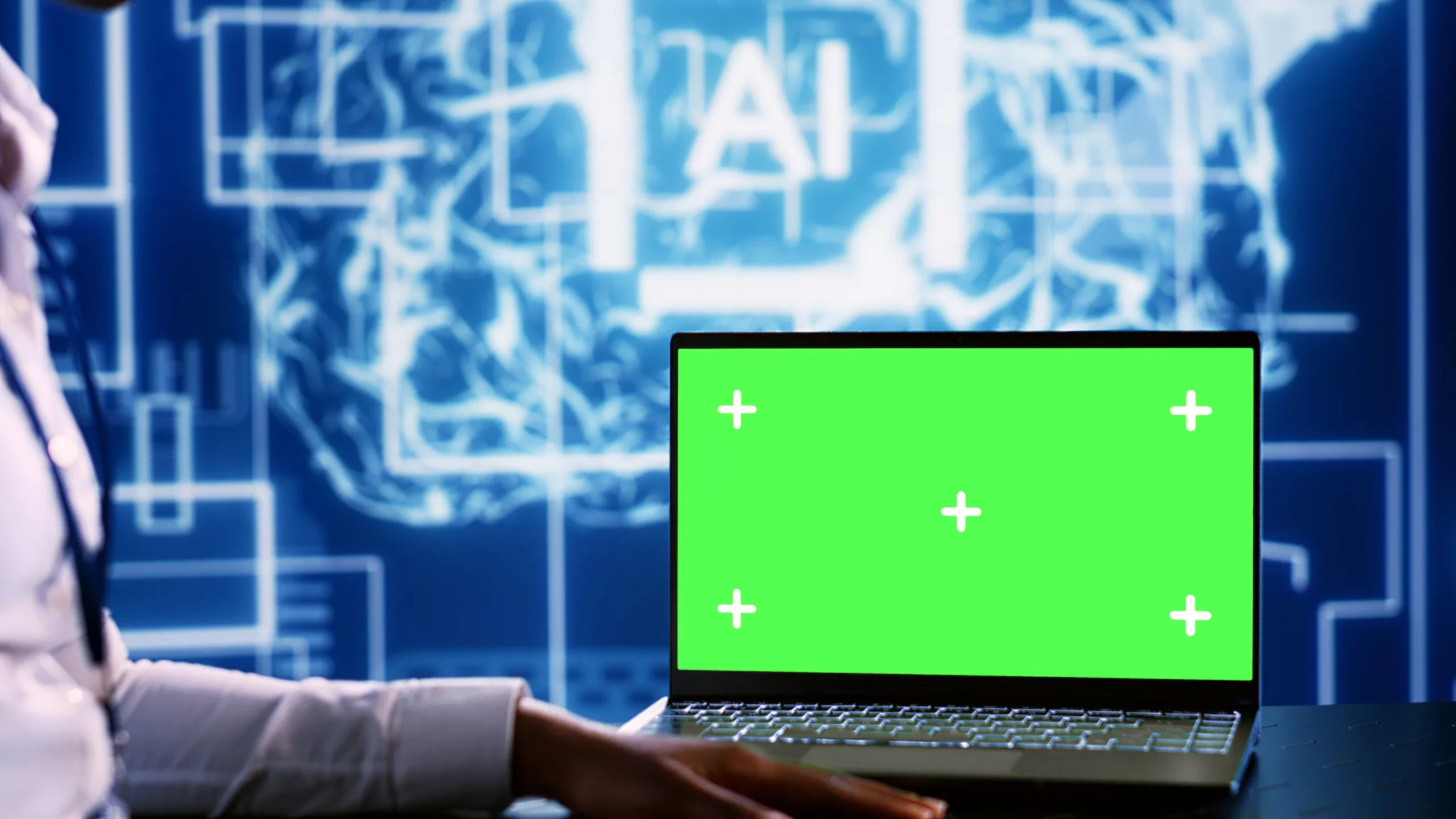 Laptop with green screen and ai logo