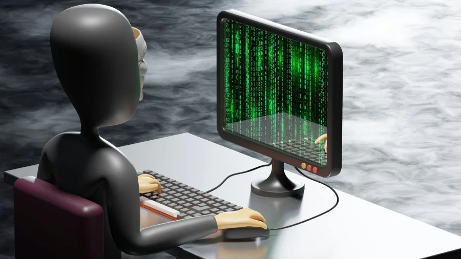 A user hiding its identity behind a mask uses a computer.