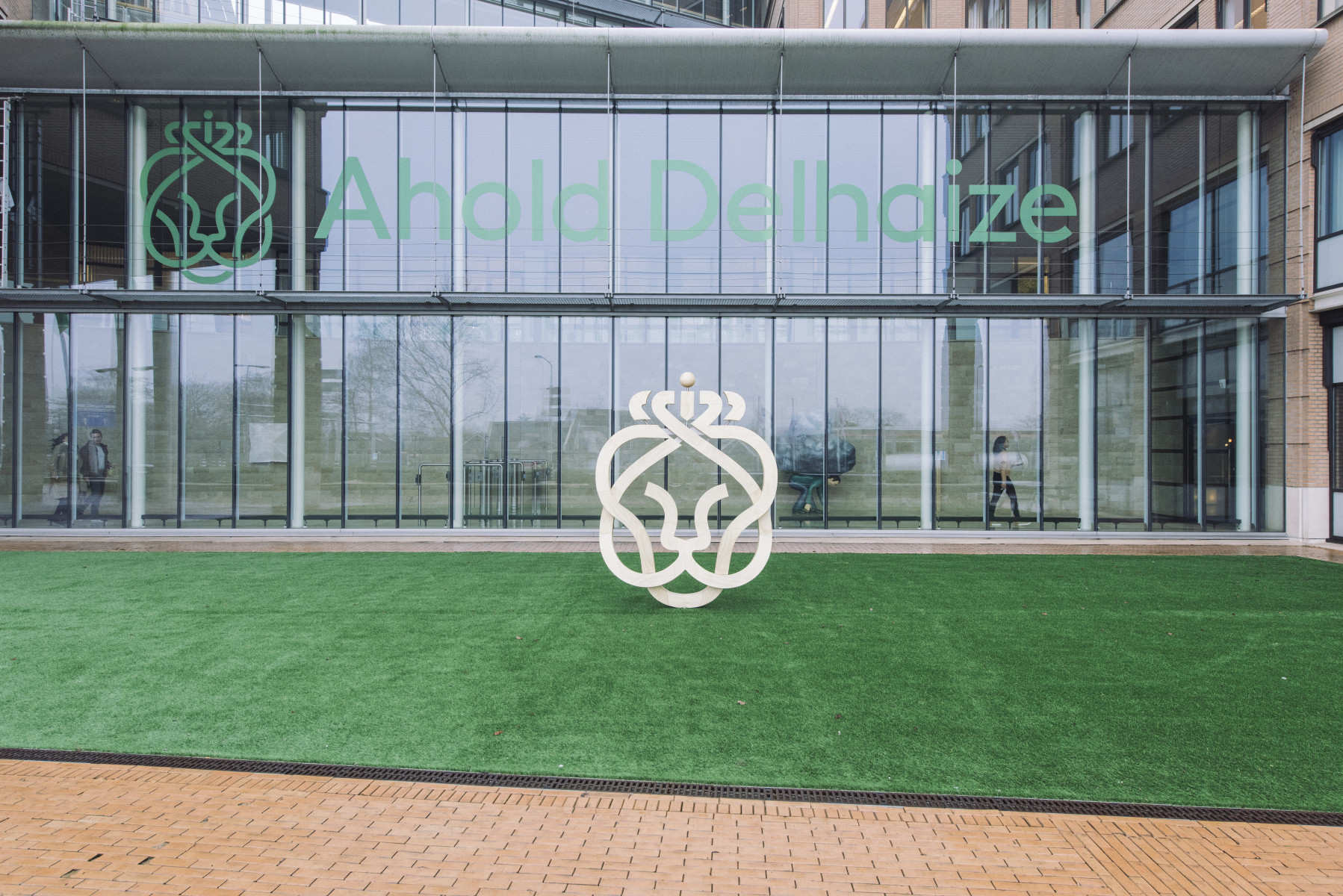 Front of building windows with Ahold logo.